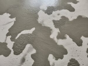 Why does my new concrete has dark spots
