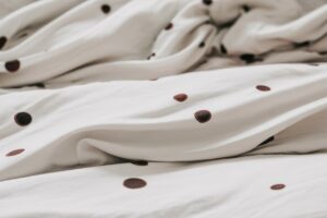 dark spots on bed sheets