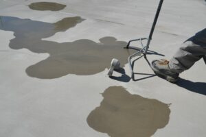 will dark spots on new concrete go away
