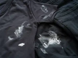 white spots on dark clothes after washing